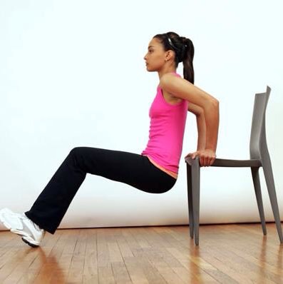 Try Chair Lifts to workout your biceps and triceps. To do, lower yourself in front of a chair with palms gripping the seat and feet on the floor. Slowly lower yourself towards the floor for a count of six and back up. Repeat ten times.