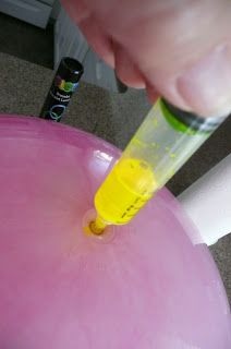 Late night volleyball! Crack a glowstick and syringe it into a bouncy ball from wallyworld. Can also use glowpaint to make the effect rechargeable! 
