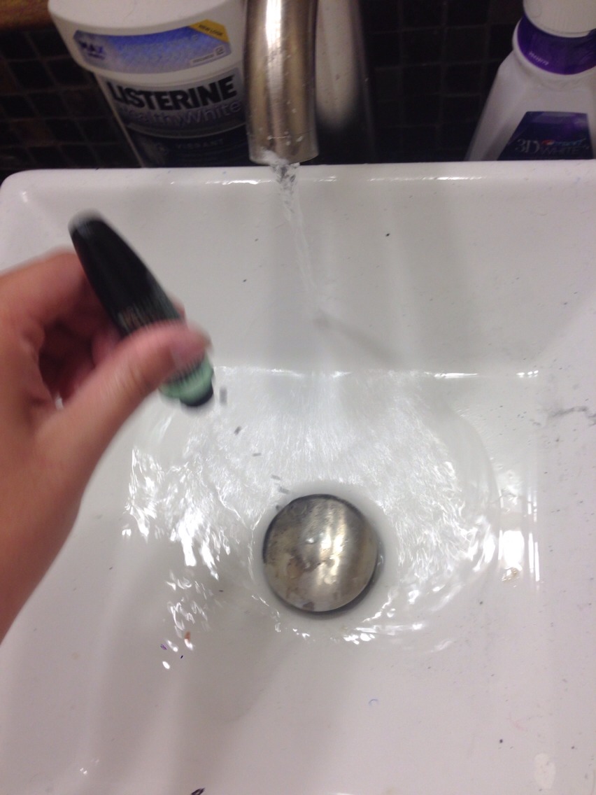 Keep cleaning the inside of the bottle until the water that pours out of the bottle is clear! If it's still black then KEEP CLEANING!