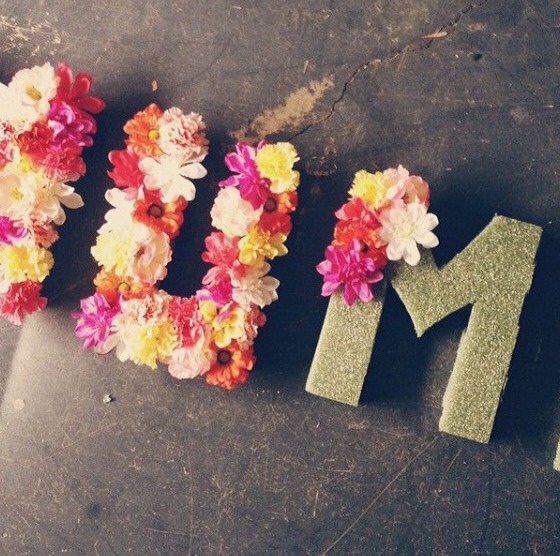 Hot glue flowers on to letters