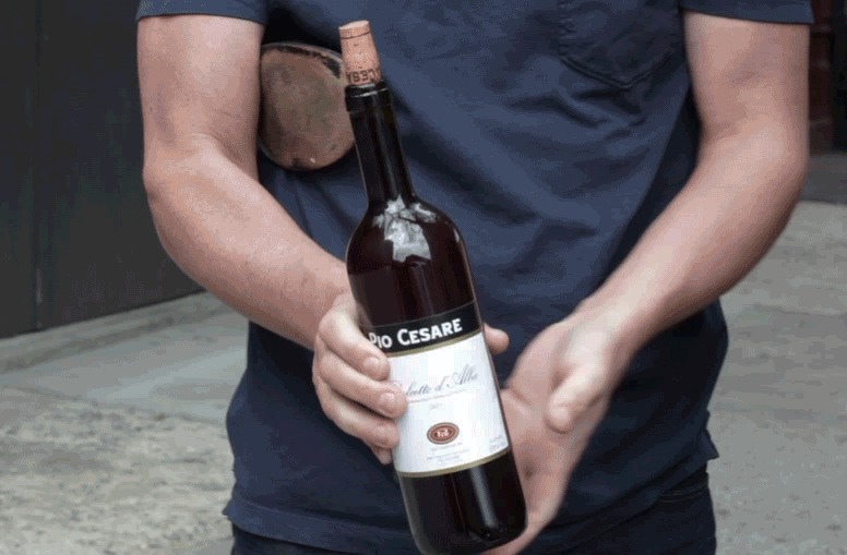 . After a few blows the cork will come out far enough that you can just yank it. (Grub Street recommends doing that last bit with your teeth for added flair.)
