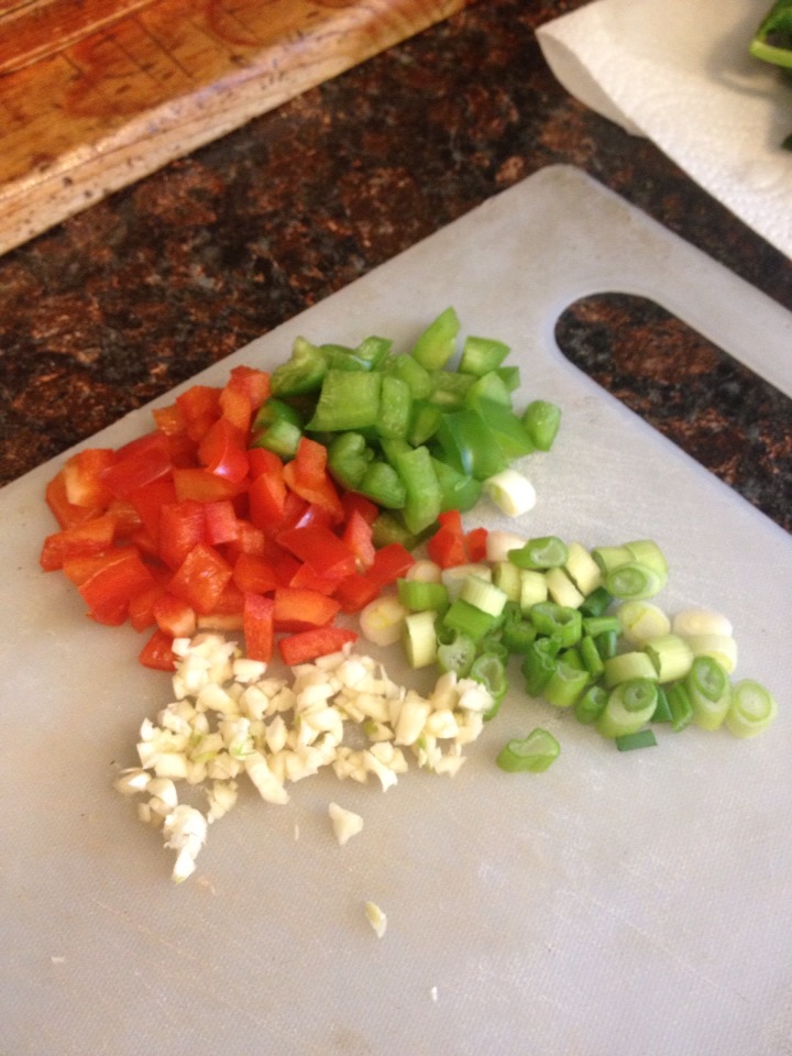 While the meats browning. Start cutting up some fresh vegetables. I used bell peppers green onion & garlic! 
