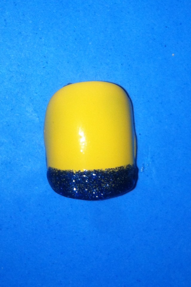 - Paint the pants on the minion, do be sure you are painting them on the flat end of the nail. 