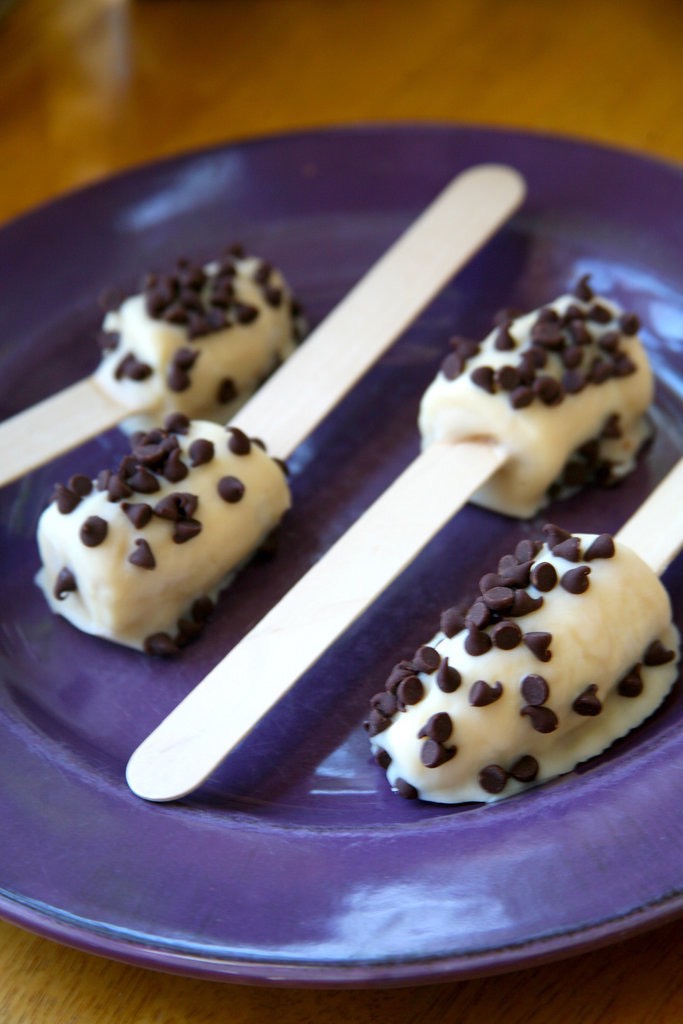 Frozen Banana Pops 
Make these treats with ingredients you probably already have in your kitchen — you only need a banana, yogurt (I used soy), and chocolate chips. One popsicle is 78 calories.