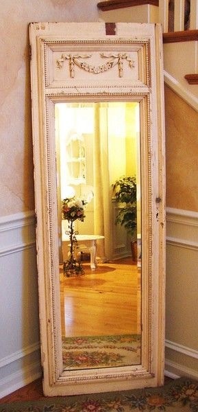 Take an old door and hot glue a mirror to it 