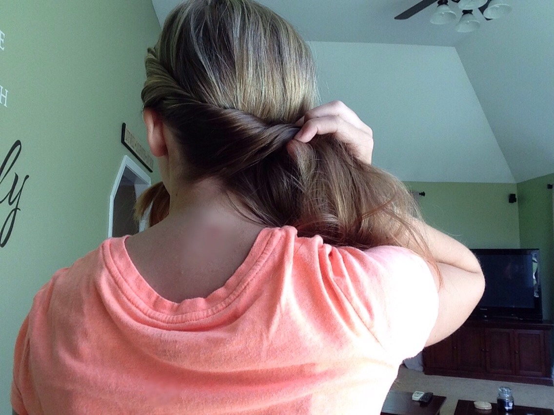 For this side of the twist, you have to carry the twist all the way around your head. It's a little harder to do this in back of your head but I know you can do it :)
