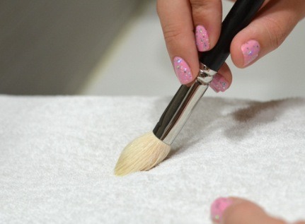 4. Use a cloth to wipe your brush clean, reshaping the bristles as you go.

