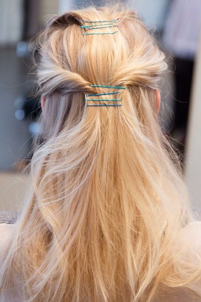 Layer a half-up style. Clip a top section, then follow an inch below with twists on each side and clip in place. 


