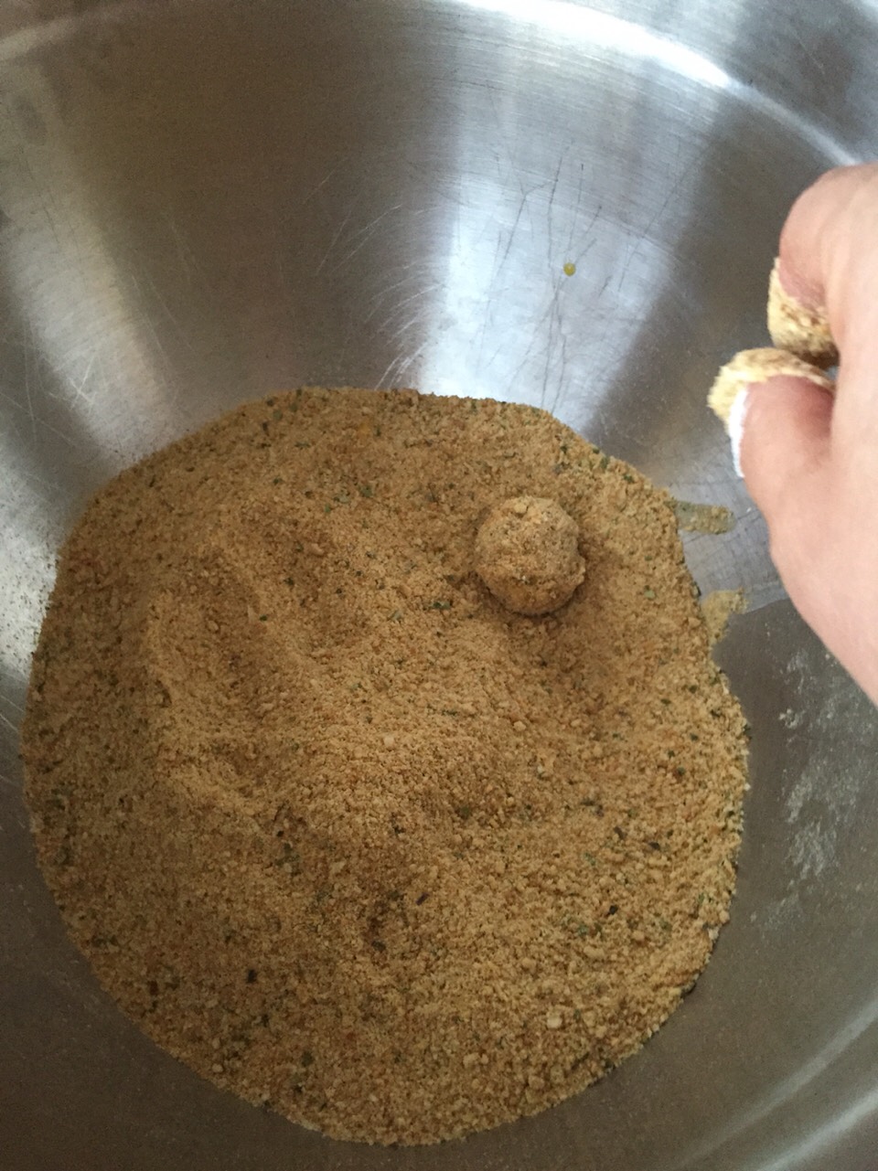 After the second egg dip it's into the bread crumbs for your olive(s). 

Bread well and give it a little roll to make sure the breading is all on well and there are no exposed parts. 