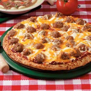 10. Meatball Press dough into an oiled 15-inch pizza pan. Top with olive oil, 1/2 cup tomato sauce and 6 ounces sliced fresh mozzarella. Bake until just crisp, then top with sliced cooked meatballs, pecorino, basil and olive oil and bake until browned.