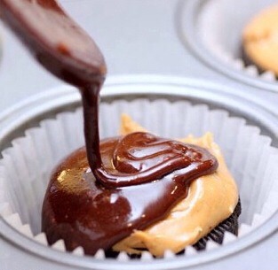 Place the Oreo stacks in cupcake lined muffin cups. Spoon 2 tablespoons of brownie batter over each stacked Oreo and let it run down the sides of the cookie.