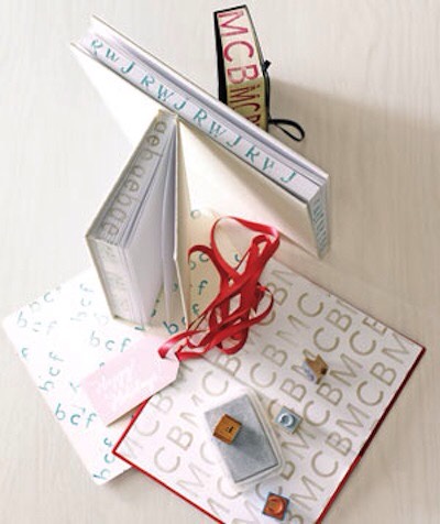 35. Monogrammed Journal
Customize a journal or book with alphabet stamps! I love the idea of writing or stamping on the page ends. Use a clamp or large binder clip to keep it closed while you’re stamping.