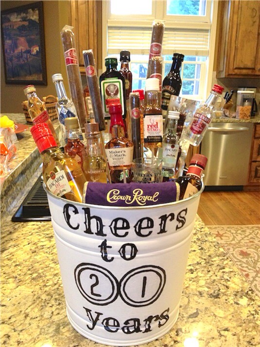 6. Liquor Bouquet
This has got to be the ULTIMATE man gift — liquor bottles, cigars, beef jerky sticks, and shot glasses. Perfect for a 21st birthday! A smaller version in a large beer mug would also be nice.