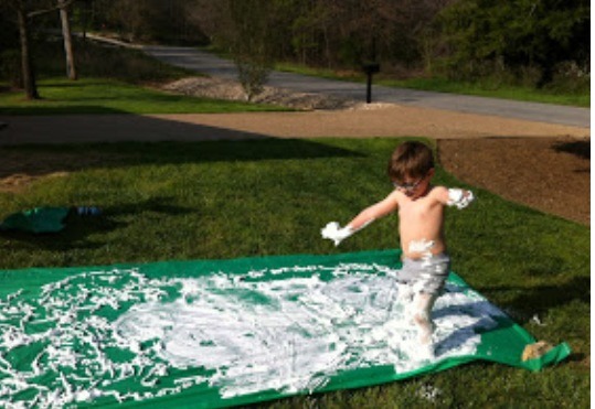 8.) HOMADE SLIP N SLIDE WITHOUT WASTING WATER!!
Use a tarp like this and nail or TAC it to the ground and then put a bunch of SHAVING CREAM all over it  for your little one!!