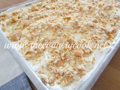 Spread crushed wafers onto the top of the cake. 
You can do this part immediately before serving the cake if you like. 
This will ensure the wafers are crunchy when you serve it.