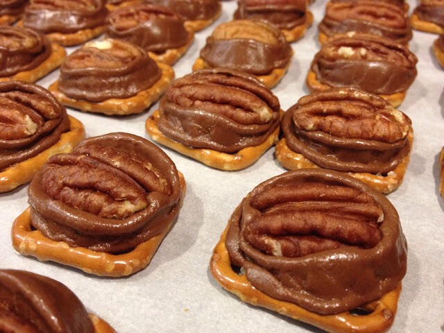 Directions
Preheat oven to 300 degrees F (150 degrees C).
Arrange the pretzels in a single layer on a parchment lined cookie sheet. Place one chocolate covered caramel candy on each pretzel.
Bake for 4 minutes. While the candy is warm, press a pecan half onto each candy covered pretzel.