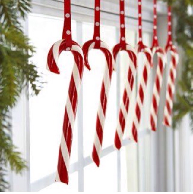 Hang candy canes from ribbon and string across a window. So simple and cute!