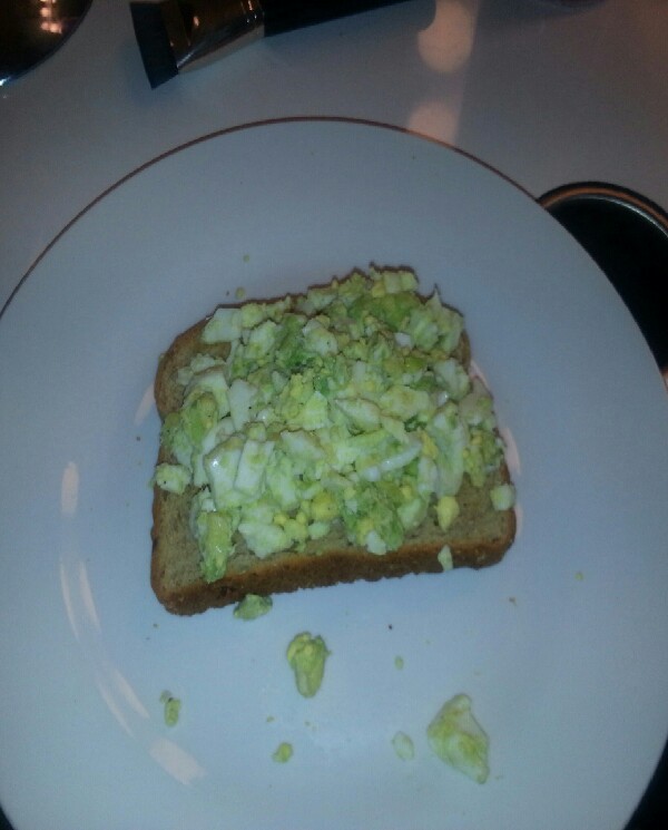 Breakfast : toast(multigrain bread) with 2 eggs mixed with 1/4 avocado on top.