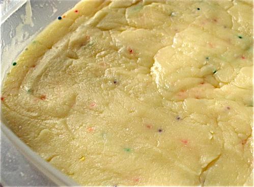 Pour into a greased pan or, as I did, a plastic container. Classy! Place in the fridge to harden.
ENJOY!
