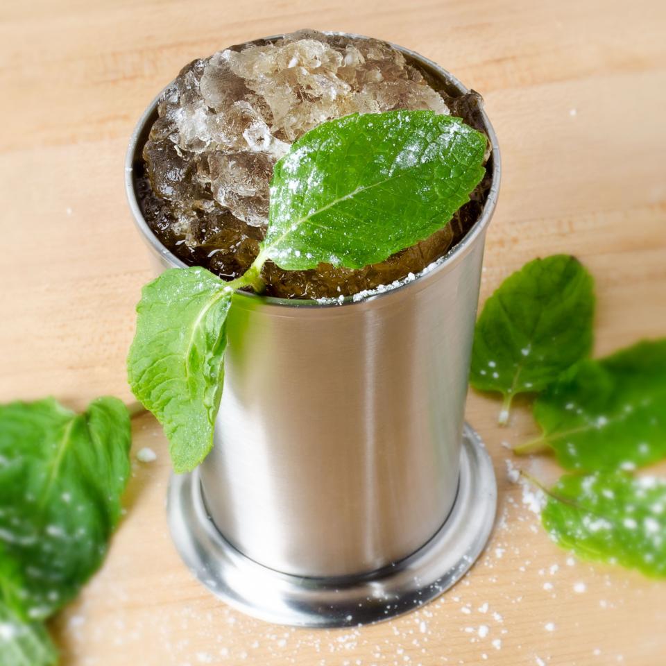 Ingredients:

3 sprigs fresh mint
1 teaspoon water
1 teaspoon granulated sugar
2 oz. bourbon
Powdered sugar
Crushed ice
