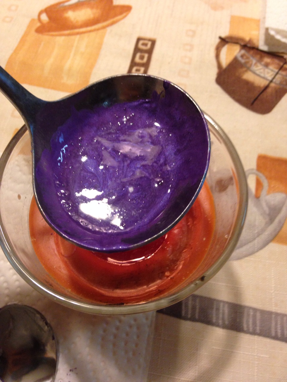 Over the flame, mix the Vaseline and powder together, getting rid of any clumps. 