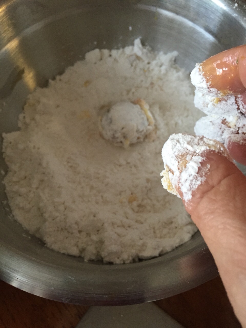 After putting the olive(s) in egg, next comes the flour, make sure the olive is covered