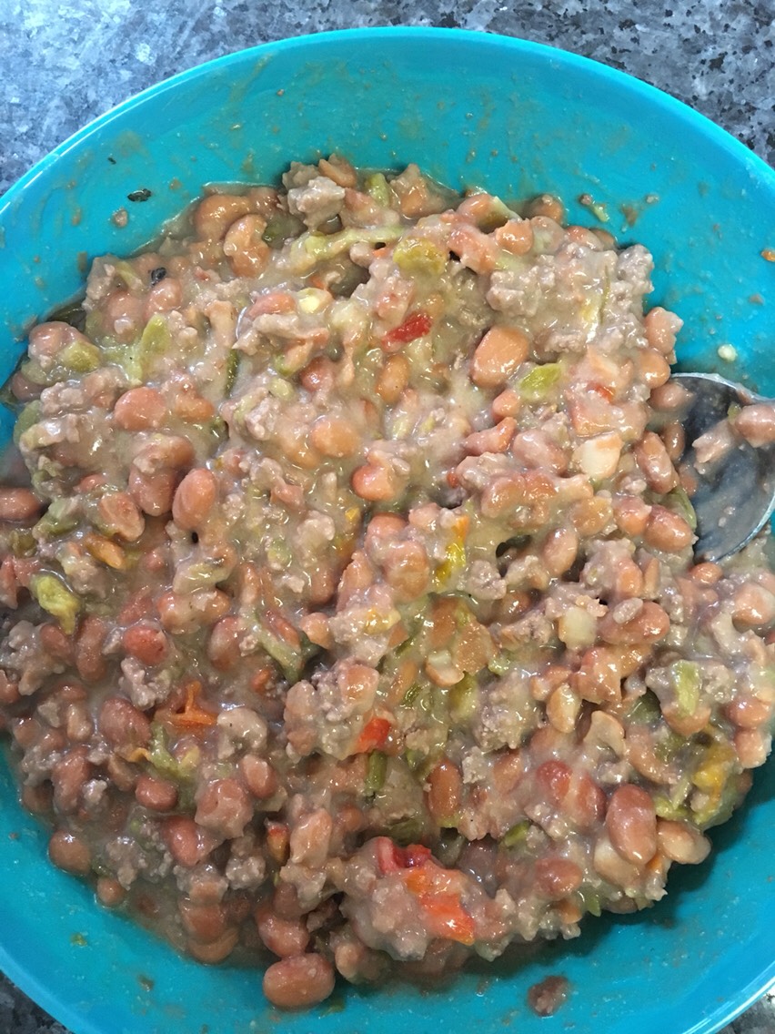 I usually make these when I have left over pinto beans. I don't measure anything, I just put the amount of all the ingredients to my liking and taste.
So to begin mix your beans, meat, green chile & salt to taste together in a bowl.