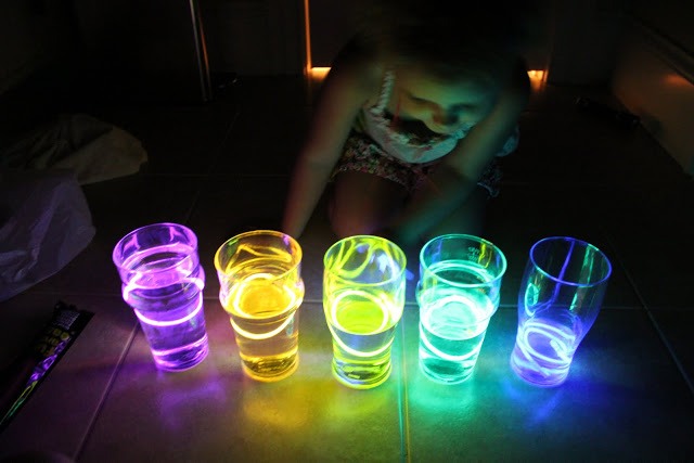 Shots with friends? There are two options...1-glue a glow stick to the outside of the glass(safer). 2-insert a small glow stick in the bottom of the glass 