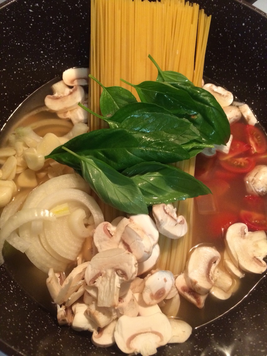 Combine everything in a large pot. Bring to a boil over high heat. Boil mixture, stirring and turning pasta frequently with tongs, until pasta is al dente and water has nearly evaporated, about 9 minutes.

Season to taste with salt and pepper, divide among 4 bowls, and garnish with basil.
