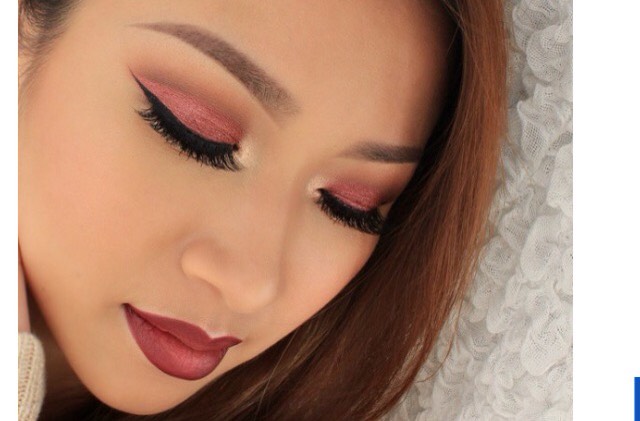 12. Shimmery cranberry eyeshadow, winged liner, cranberry lip. 