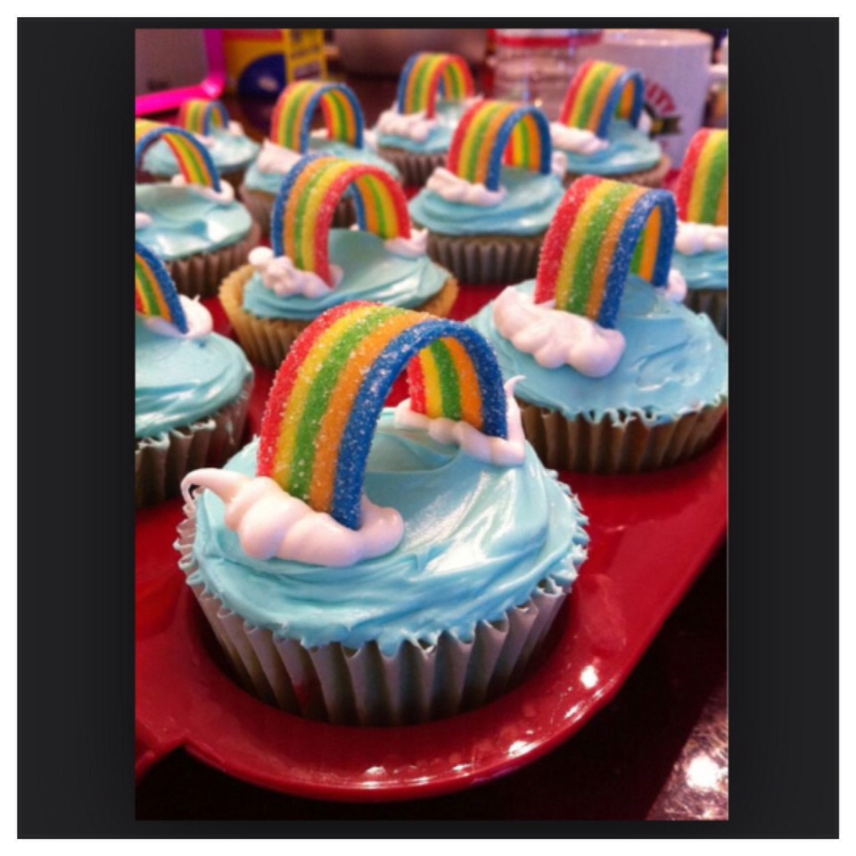 For this cupcake frost it with blue icing. Then  squeeze white icing on the ends and stick a fruit roll on the cupcake