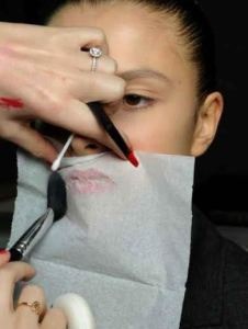 1. After applying a lipstick, hold a tissue tightly over your lips and go over them with translucent powder. This will make the lipstick stay on longer.