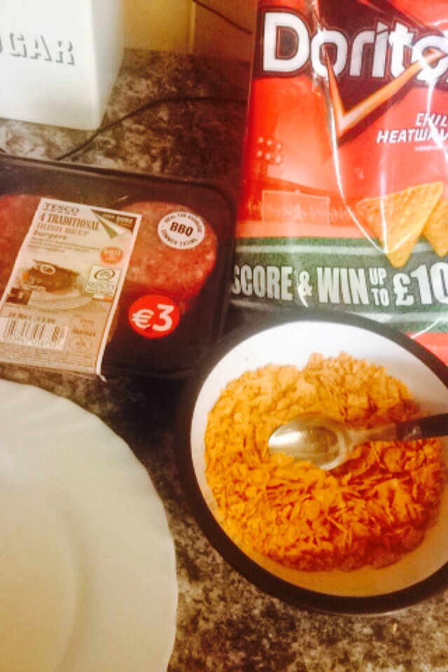 Crush up a 1/3 of a large bag of Doritos in a bowl
Take a beef burger, dip into oil then into the Doritos