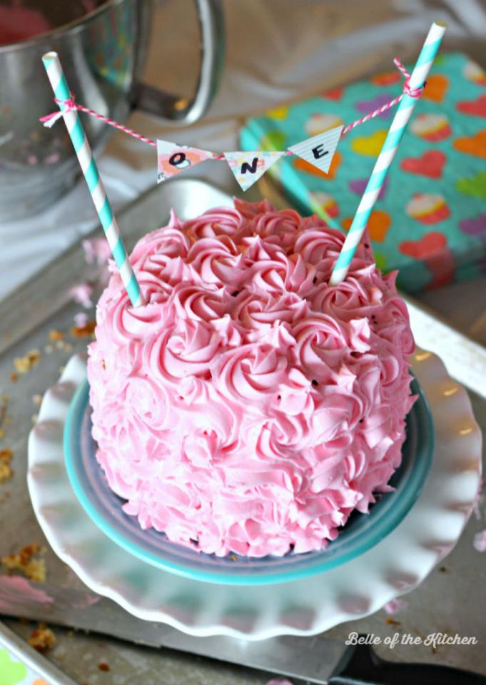 8. Carefully stick the two straws into your cake, pushing down until both are level and to your liking. Then stand back and admire your finished product!
