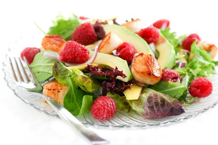 Raspberry and Scallop Salad

This salad incorporates all the tastes of summer in one bite! Raspberries, mangos, and avocados on a bed of mixed greens — all topped with some beautiful seared scallops — sounds just about perfect!