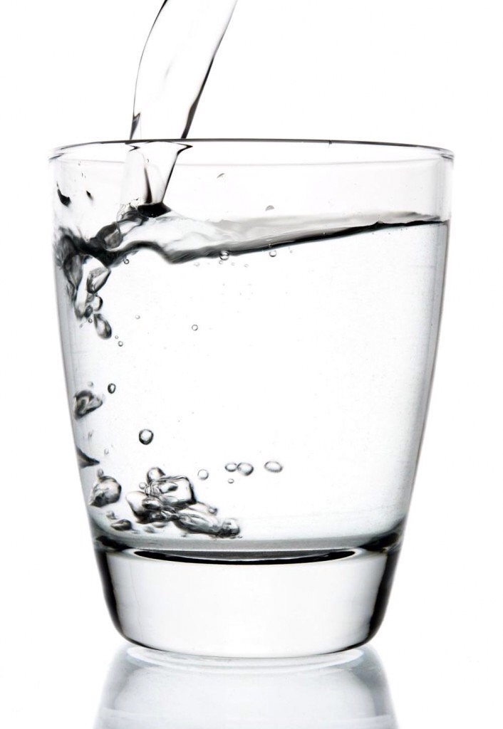 Add two cups of warm water to a bowl. Make sure it's not too hot! The warm water will help open up your cuticles and let the mixture take action.