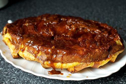 Place a serving plate over top of dish (bottom side up), and, using potholders, hold pudding over sink and flip pudding onto it.

Lift baking dish off plate; scrape any extra caramel from pie dish over pudding.
