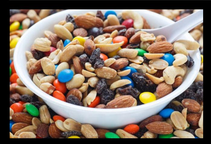 9. TRAIL MIX!
Although healthy trail mix is possible (ones made with just nuts, some dark chocolate, and some dried apricots is one option), most of the versions we are buying at the store are loaded with candy-coated pieces, yogurt-covered raisins, sesame sticks and deep-fried banana chips.