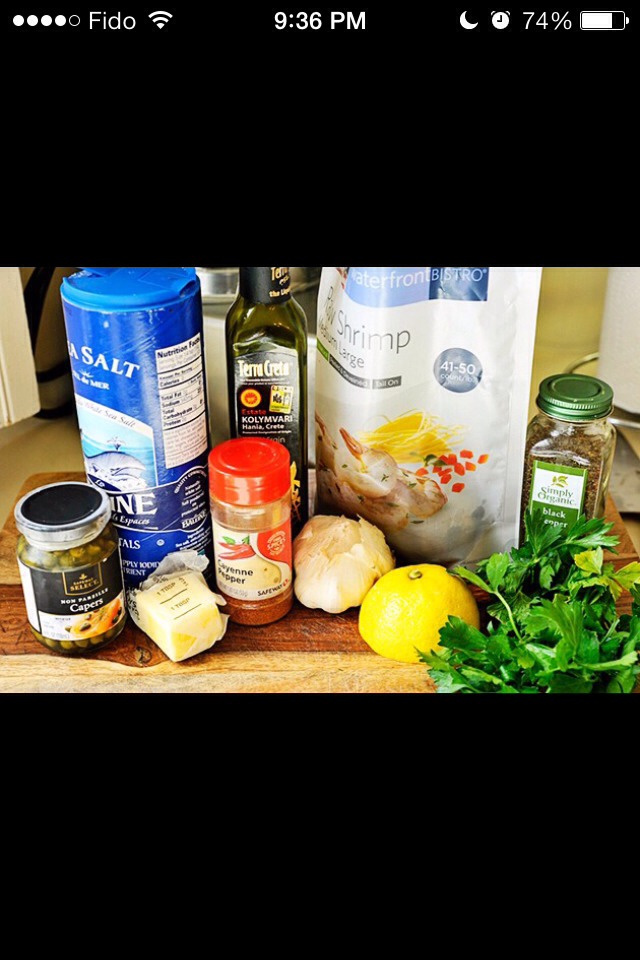3 tbs olive oil
10 cloves garlic
2 pounds shrimp, shells and tails removed (21-25 size is perfect)
sprinkle of kosher salt and black pepper
1 stick butter, divided into chunks of about 1 1/3 tbs each
1/3 C fresh lemon juice
3 tbs capers and a bit of juice
red pepper to taste
2 tbs fresh parsley