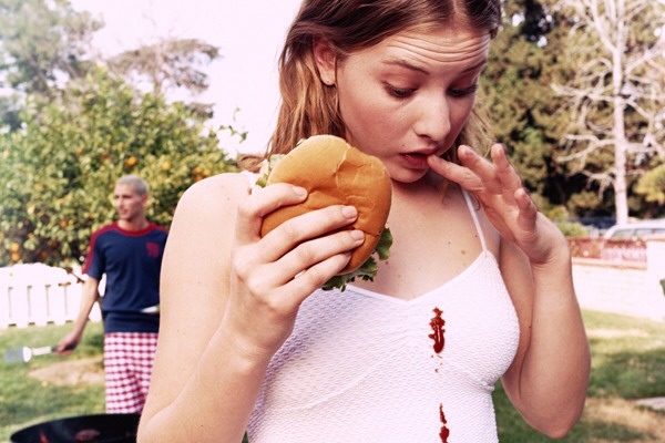 5. Get Out Grease Stains You wear your cute new tee to your friend's party only to spill pizza, a hamburger, basically any greasy food right down the front of it. Before you wash it, dab a cotton ball full of baby powder onto the stain, and let it sit for an hour. It'll be as good as new!