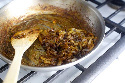 Add vinegar and syrup and reduce heat to medium. Cook, stirring, until onions are jammy and broken down, another 10 to 15 minutes.