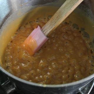 Stop stirring and continue cooking 10 minutes or until the color of light brown sugar. Remove from heat; carefully stir in butter and milk. Place pan over medium-high heat until caramelized sugar melts. Bring to a boil; cook 1 minute.