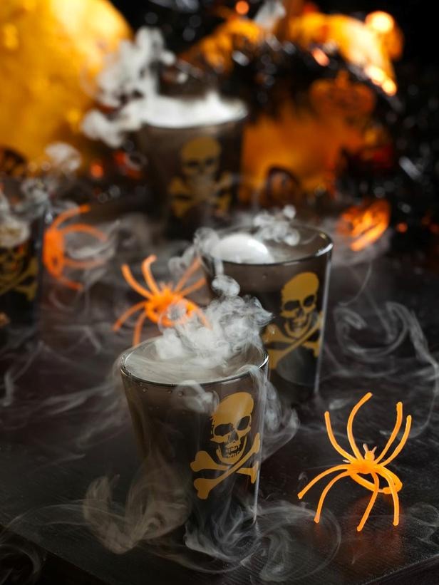 Smokin' Skulls Shot

Dry ice chips give this sinister sip its signature vaporous effect while bourbon lends a smoky flavor. Serve in shot glasses — but allow dry ice to completely dissolve before drinking. 

