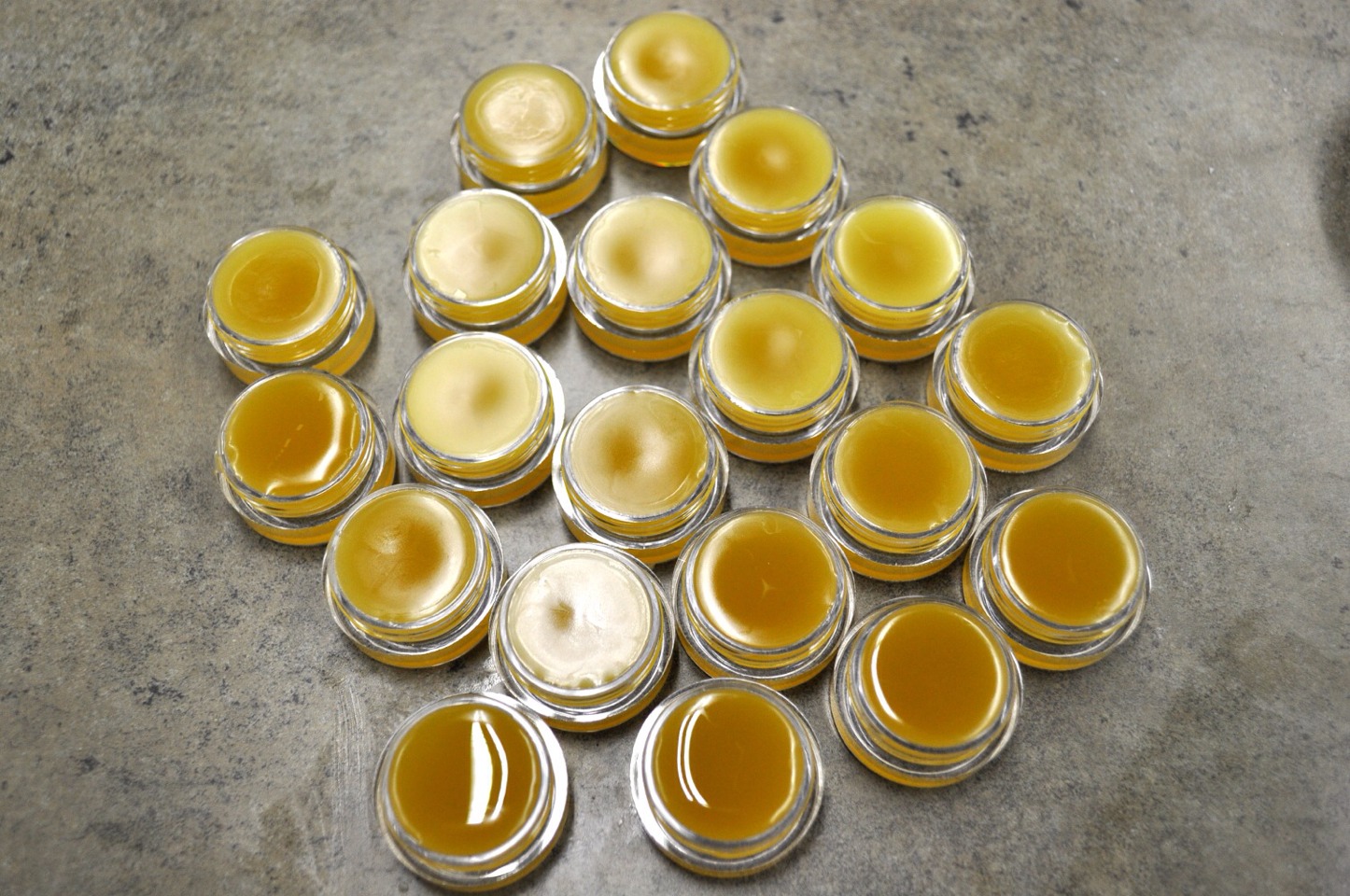 LIP BALM
1/2 cup natural beeswax, grated
1/4 cup coconut oil
10 to 12 drops lemon essential oil
1 teaspoon honey
2 drops vitamin E oil
12 small plastic containers with lids