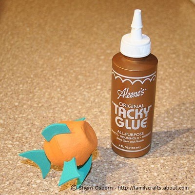 Use craft glue to attach the fins to the fish body. If you want the glue on the fins to dry faster, consider using a hot glue gun.