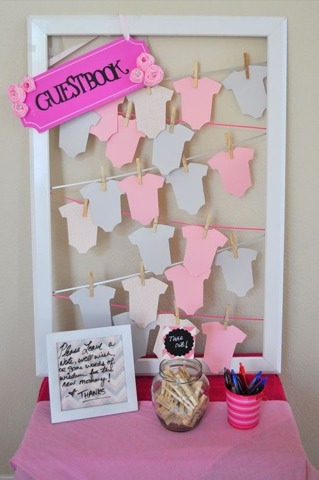 Nice alternative to the regular 'ol guest book. Cut shapes pin to yarn with mini clothes pins.