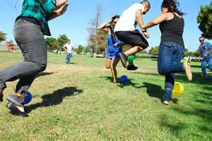 after every other player tries to blow the each others' balloons by stomping on them. The game starts with the participants tying a balloon on one ankle, whichever they prefer and most strategic. For example, you may have a tendency of stomping with your right foot,