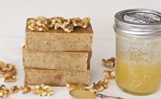 SOAP
5 oz. canola oil
15 oz. coconut oil
15 oz. olive oil
5 oz. safflower oil
5 oz. sunflower oil
12.6 oz. milk frozen to a slushy state 
6.4 oz. lye. 

Add 3 tablespoons of honey right before mixture reaches trace. Mix in 3 ounces of finely ground walnuts at trace. Wait 4 weeks before use.