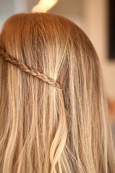 Go a little boho. Braid a small section at the hairline and pin at the center of the head. 

