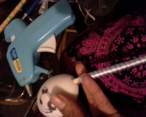 7. Glue the stick to the egg.